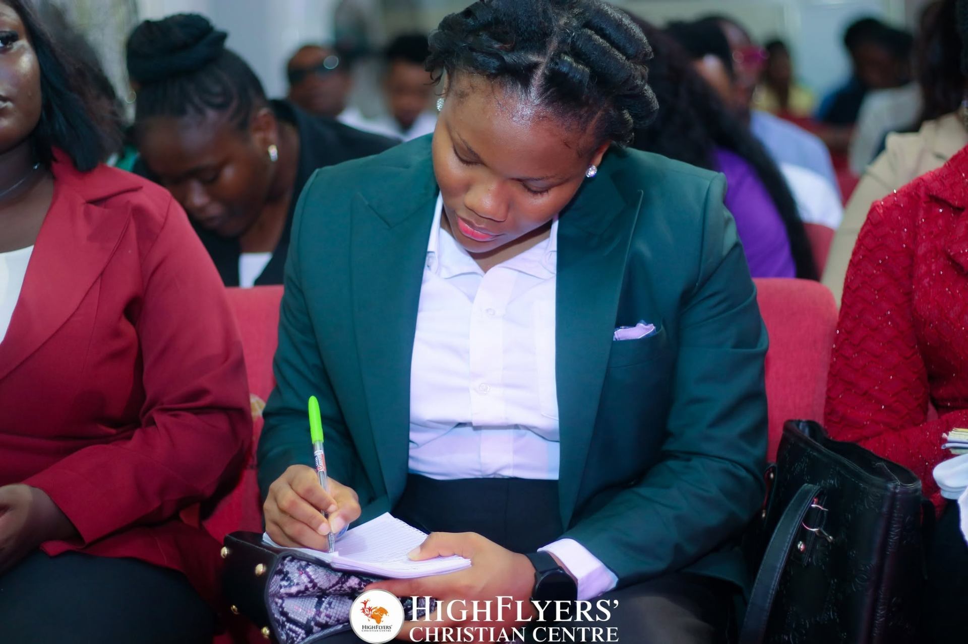 Member taking sermon notes