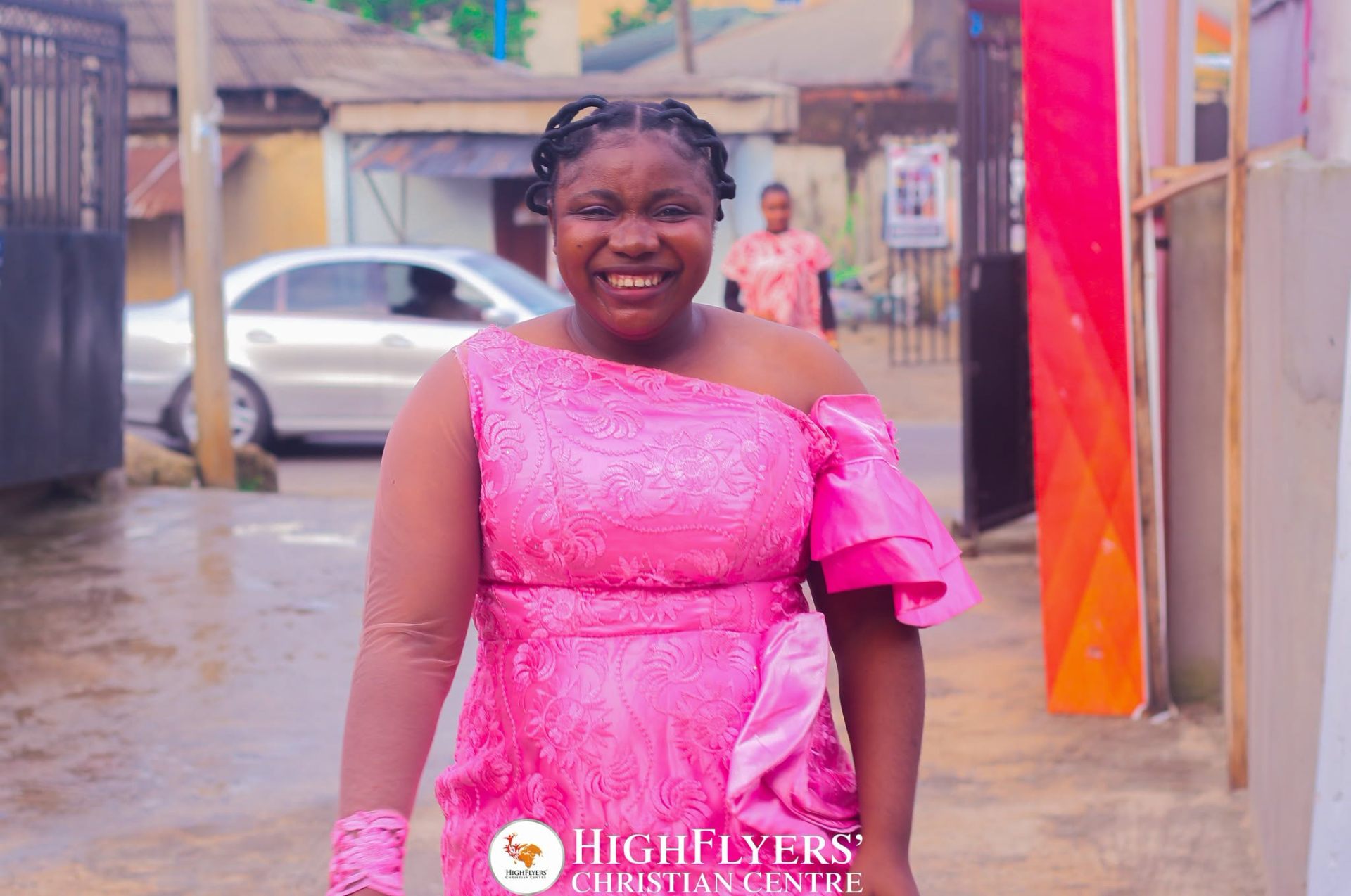 Smiling member arriving at church